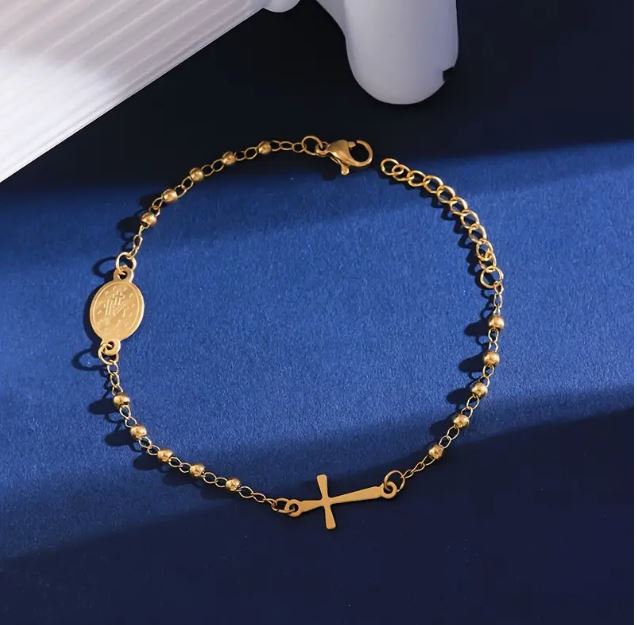Delicate Stainless Steel Rosary bracelet With Small Cross. Available in gold plated.