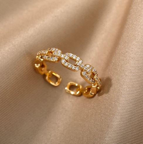 Adjustable gold plated, stainless steel geometric style chain ring with cubic zirconia