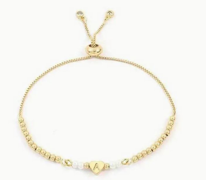 Adjustable and custom stainless steel bracelet with heart initial letter, golden beads and faux pearls