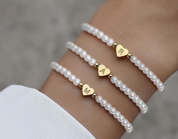 Custom and elastic faux pearls bracelet with stainless steel heart charm and initials