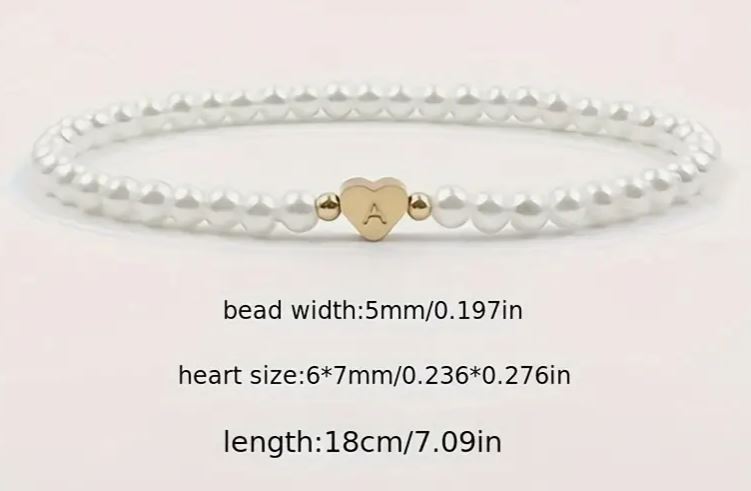 Custom and elastic faux pearls bracelet with stainless steel heart charm and initials