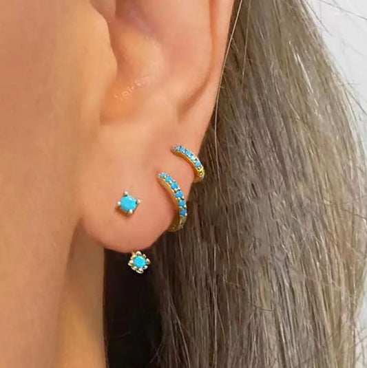 Set of three 14K gold plated copper earrings with turquoise colored stones.