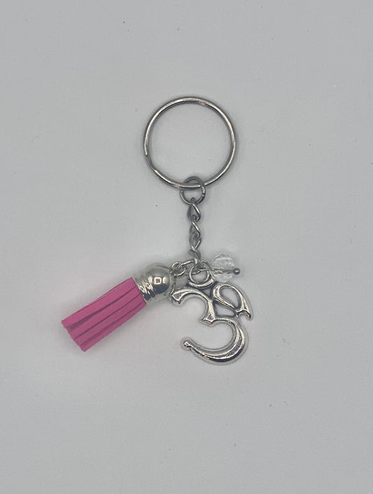 Key holder with fuchsia tassels and OM charm and clear bead