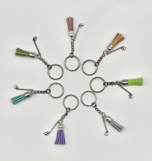 Key holder with tassels and ball and golf club charms