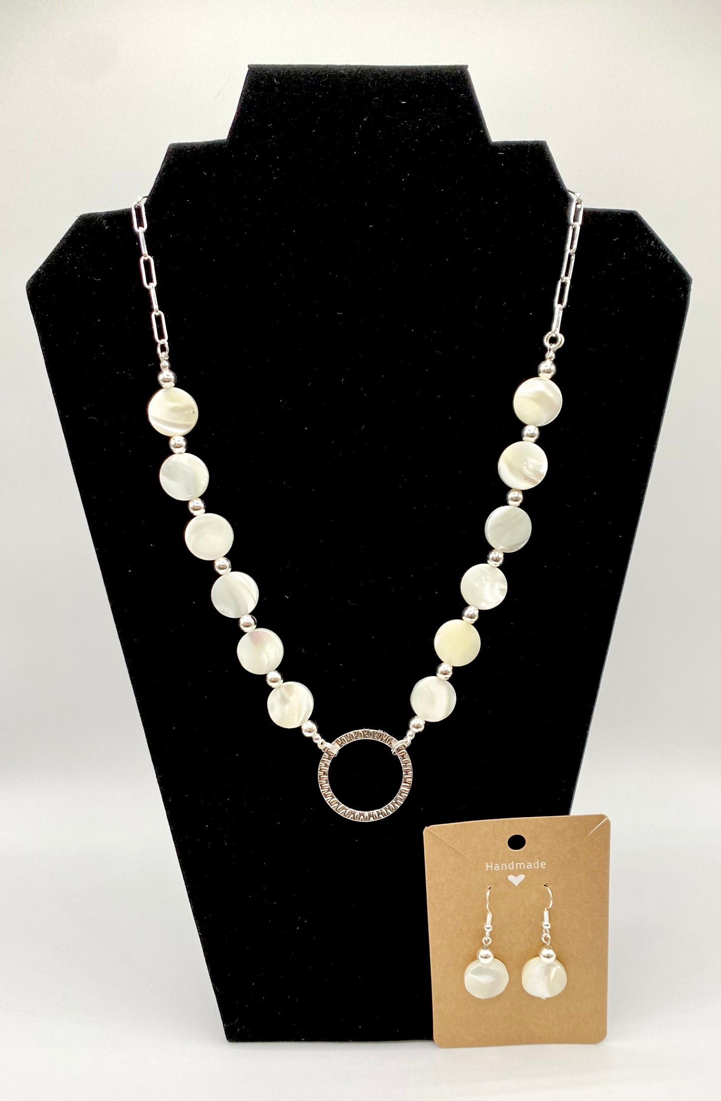 Round shells necklace with silver plated beads and circle Rhodium pendant