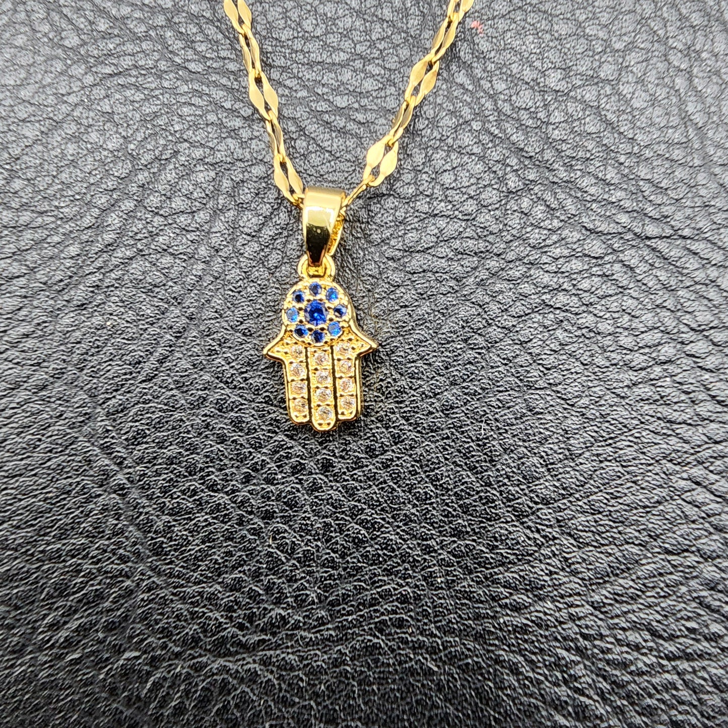 Golden stainless steel necklace with delicate Hamsa Hand zircons pendant