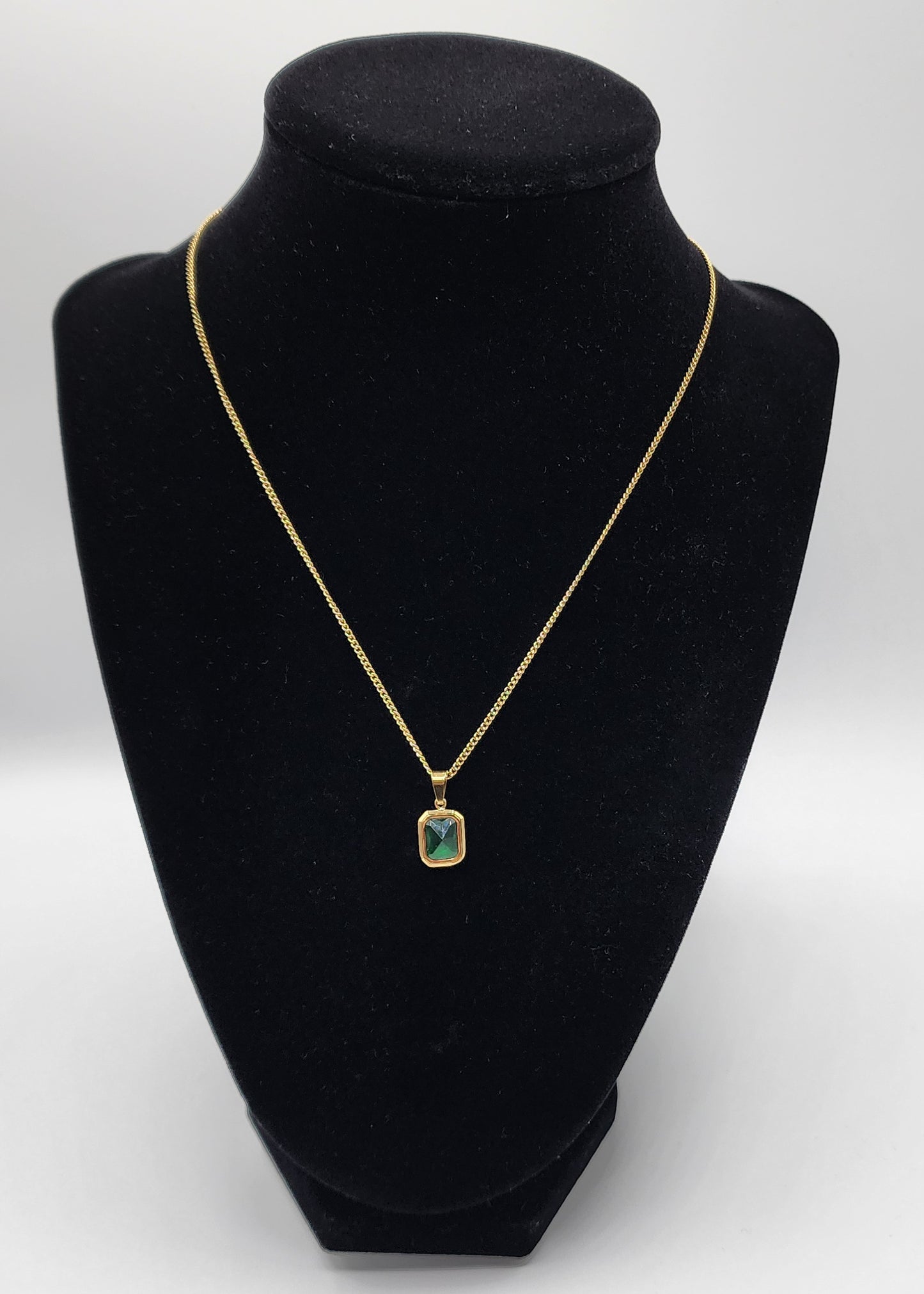 Gold plated stainless steel necklace with green squared crystal pendant