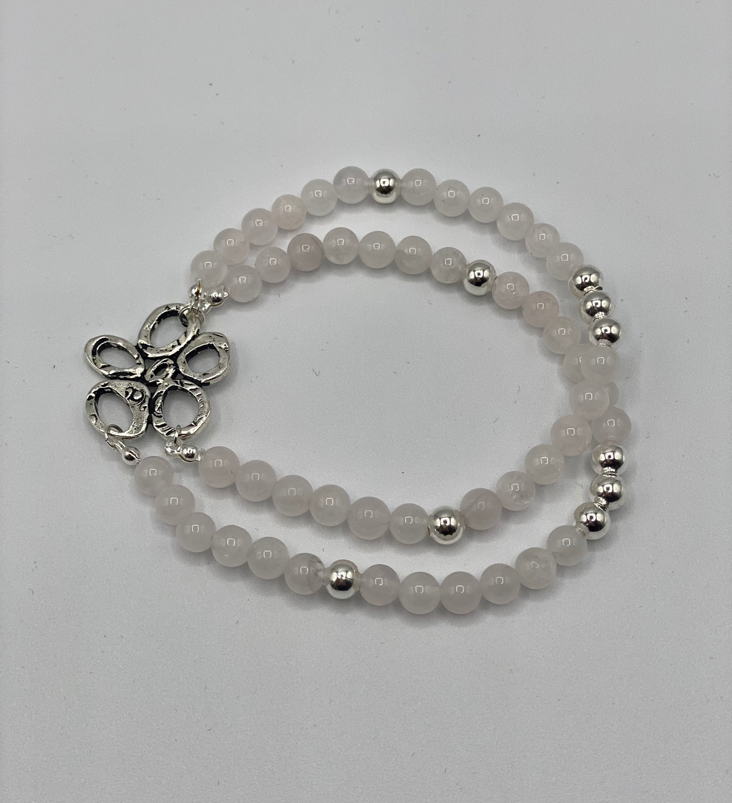 Double bracelet with semi-precious rose quartz beads, charm and silver plated beads