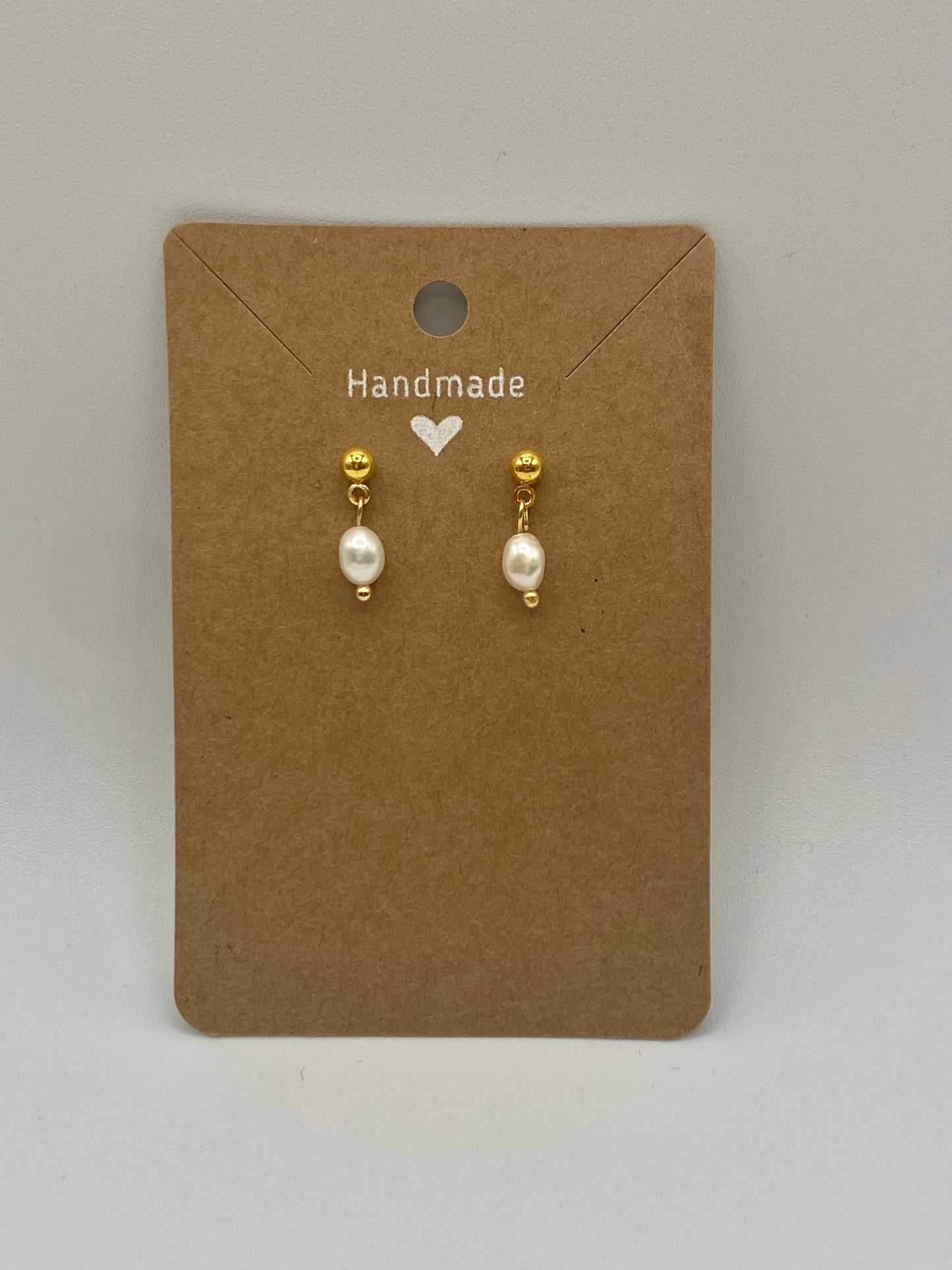 Golden stainless steel earrings with freshwater pearls