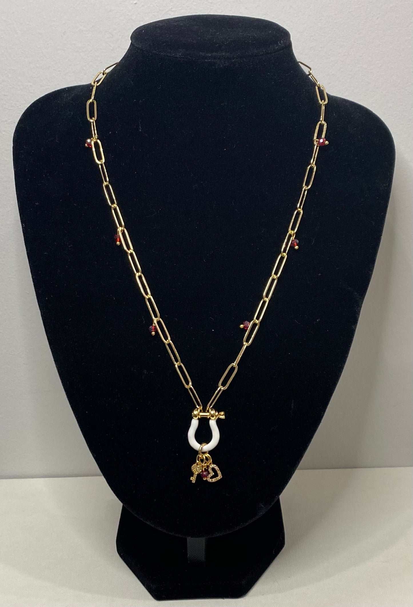 Necklace with 2 gold plated charms and 7 Murano crystals